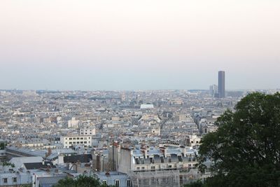 High angle view of buildings in city against clear sky