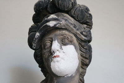 Close-up of statue against gray background
