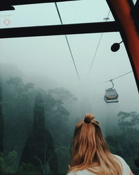 Rear view of woman looking at mountain view