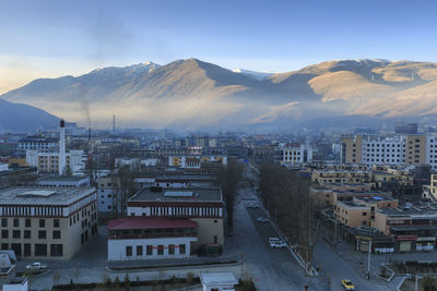 Aerial view of cityscape against sky