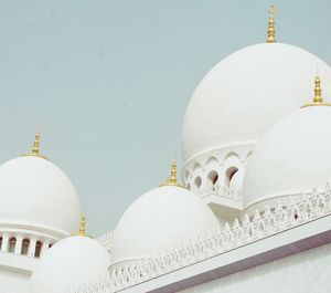 Low angle view of mosque against clear sky