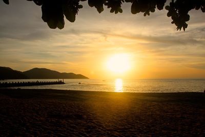 Scenic view of calm sea at sunset