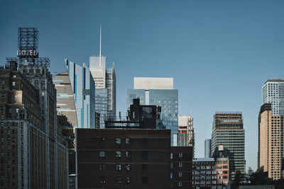 Skyscrapers in city against clear sky