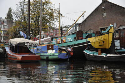 Boats moored in canal