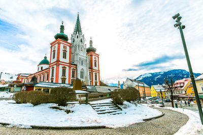 Low angle view of building against sky during winter