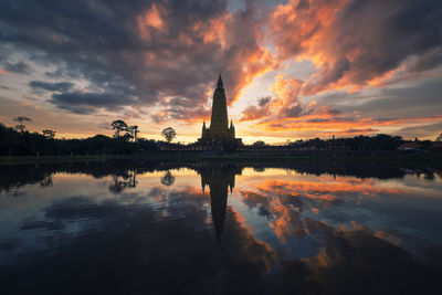 Reflection of church in lake during sunset