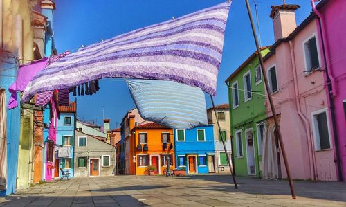 Exterior of colorful houses in town against clear blue sky