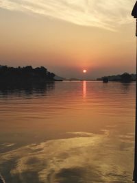 Scenic view of sea against sky at sunset