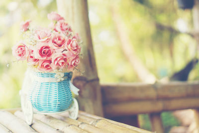 Close-up of pink rose on table