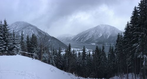 Scenic view of snow covered mountains against sky