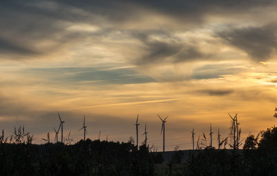 Scenic view of field against sky during sunset