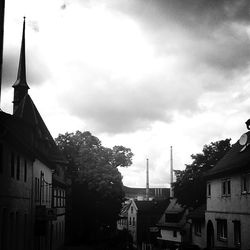 Low angle view of building against cloudy sky