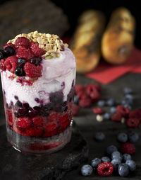 Close-up of parfait fruit, berries on table