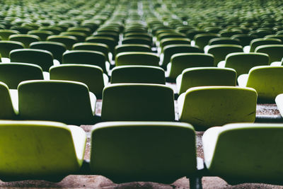 Full frame shot of empty chairs at stadium