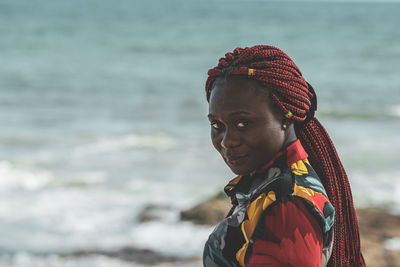 Portrait of woman looking at sea