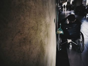 Rear view of people walking in bus