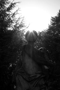 Low angle view of statue against sky