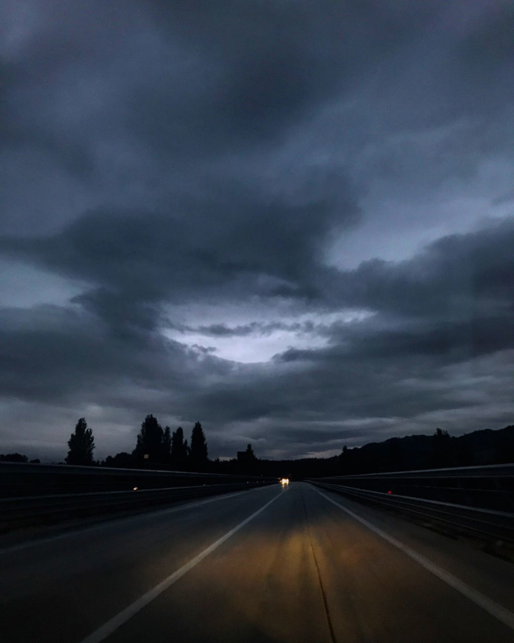 cloud - sky, road, the way forward, transportation, sky, dramatic sky, scenics, weather, storm cloud, nature, dusk, landscape, no people, journey, tranquility, outdoors, day, thunderstorm, beauty in nature, tree