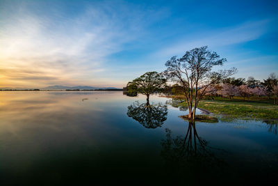 Scenic view of lake against sky during sunset