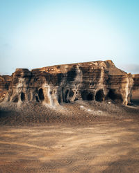 Rock formations in desert against clear sky