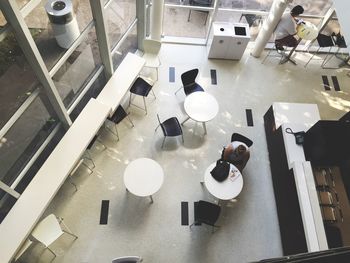 High angle view of people sitting in cafe