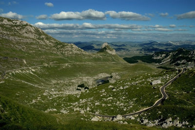 Scenic view of landscape and mountains against sky