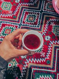 Midsection of woman holding tea cup