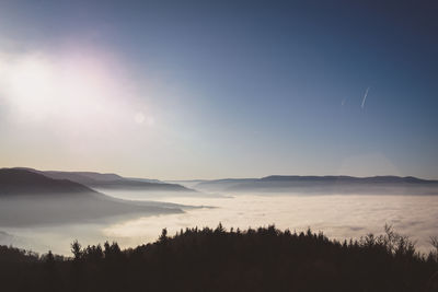 Scenic view of silhouette mountains against sky