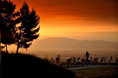 Scenic view of landscape at sunset