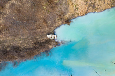 Aerial view of boat moored at lakeshore