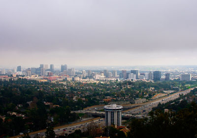 Aerial view of cityscape against sky