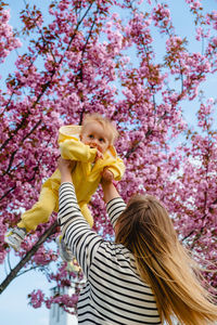 Young woman holding flower