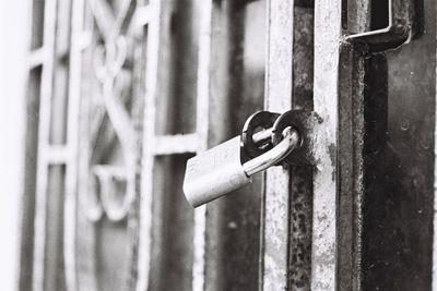 Close-up of padlock on metal chain