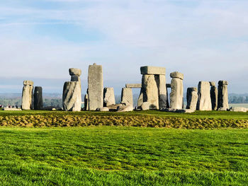 Built structure on field against sky