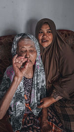 A couple of mothers and children of a muslim family are happy on the day of eid.