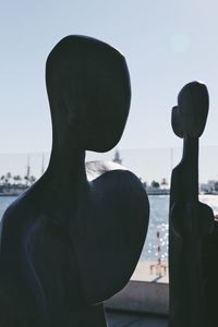 Close-up portrait of silhouette man against sky