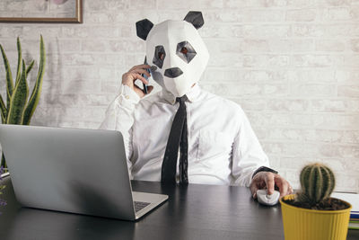 Man using laptop on table