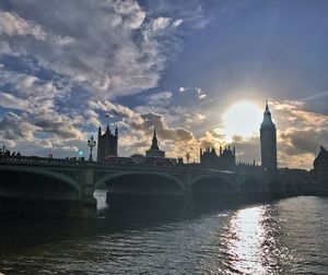 View of bridge over river against cloudy sky