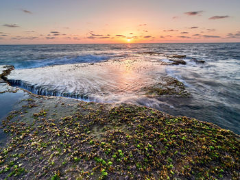 Scenic view of sea against sky during sunset