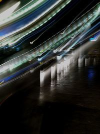 Light trails on illuminated city at night