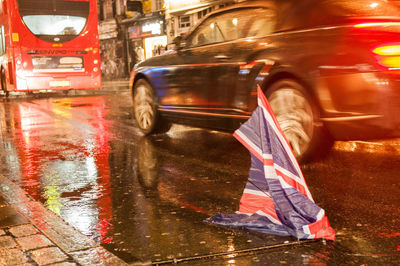 Blurred motion of wet car on street in rainy season