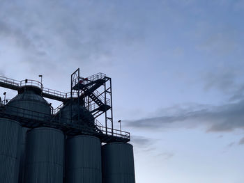 Low angle view of factory against sky