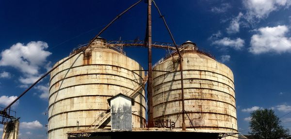 Low angle view of factory against sky