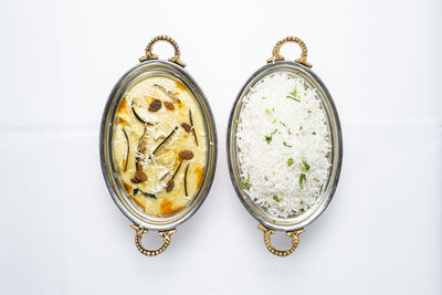 High angle view of food on table against white background