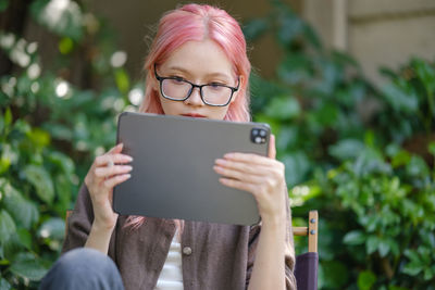 Young woman using digital tablet