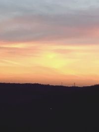 Scenic view of silhouette landscape against sky during sunset