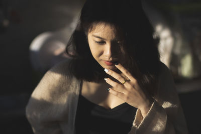 Portrait of young woman looking away