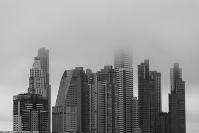 Modern buildings in city against sky