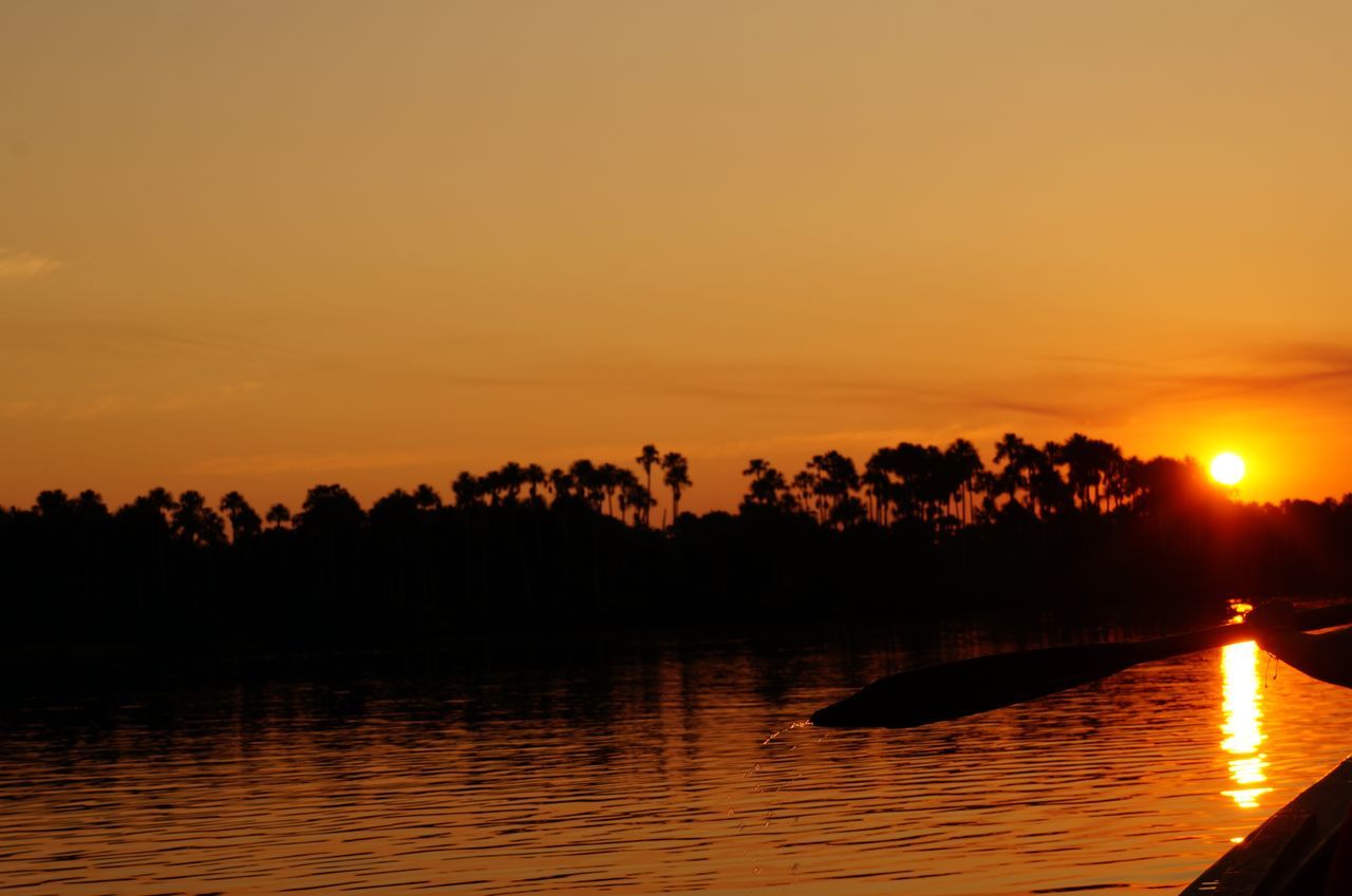 SUNSET OVER CALM LAKE