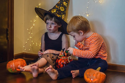 Children eat candies after halloween party.